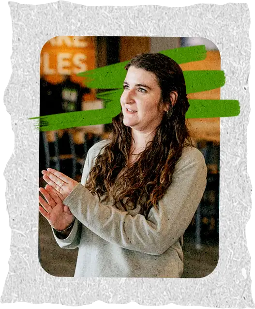 A student clapping during worship